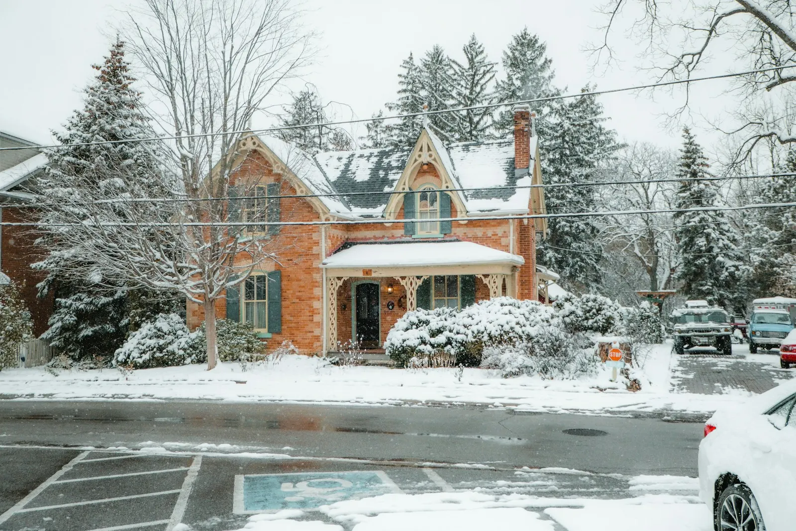 A red brick house covered in snow